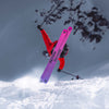 Freeski skier riding powder with black and purple all-mountain Freeski Faction Prodigy 3 ski