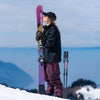 Freestyle skier kissing their yellow and purple freestyle Faction Studio 1 ski 2026