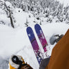 Freeride skier riding powder with yellow and purple powder and freeride Faction Studio 3 ski 2026